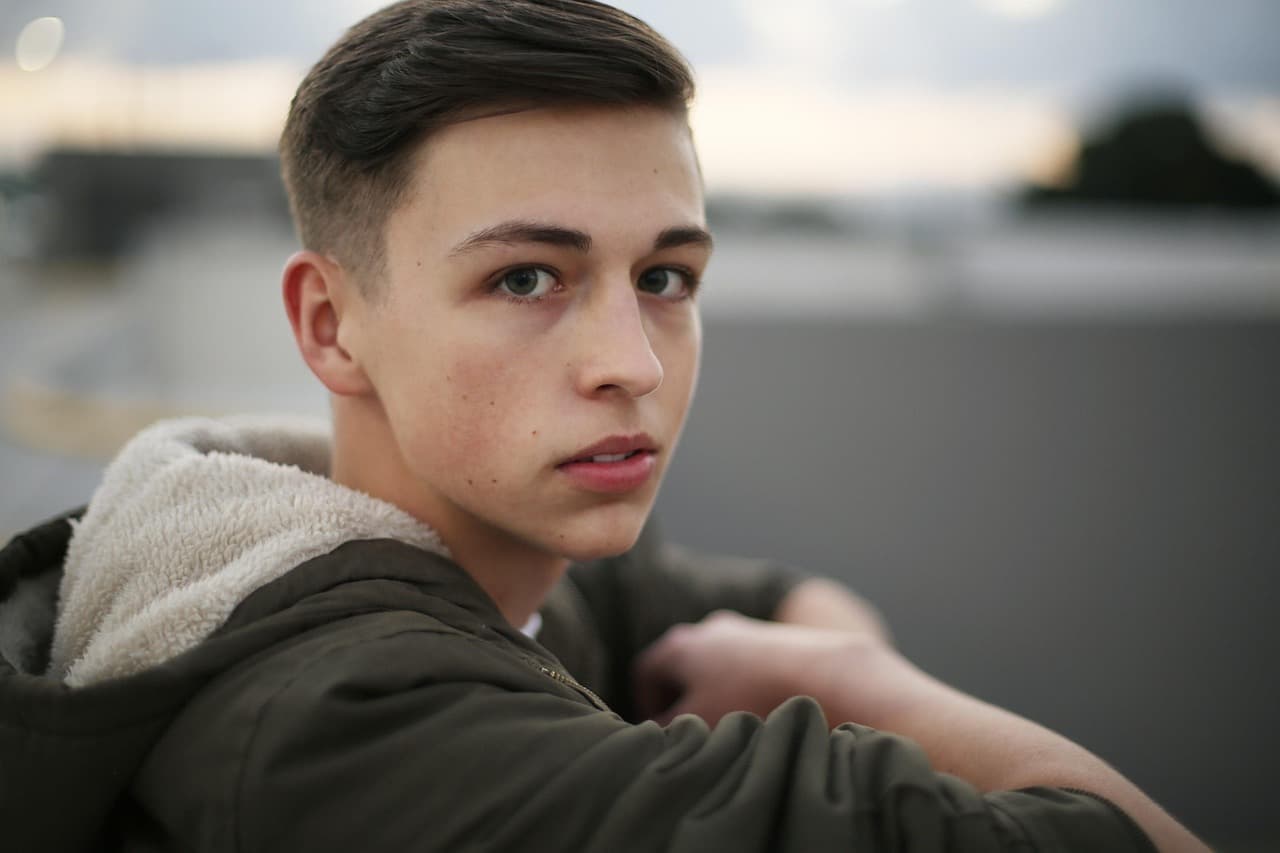 A teenage boy with a fresh short cut